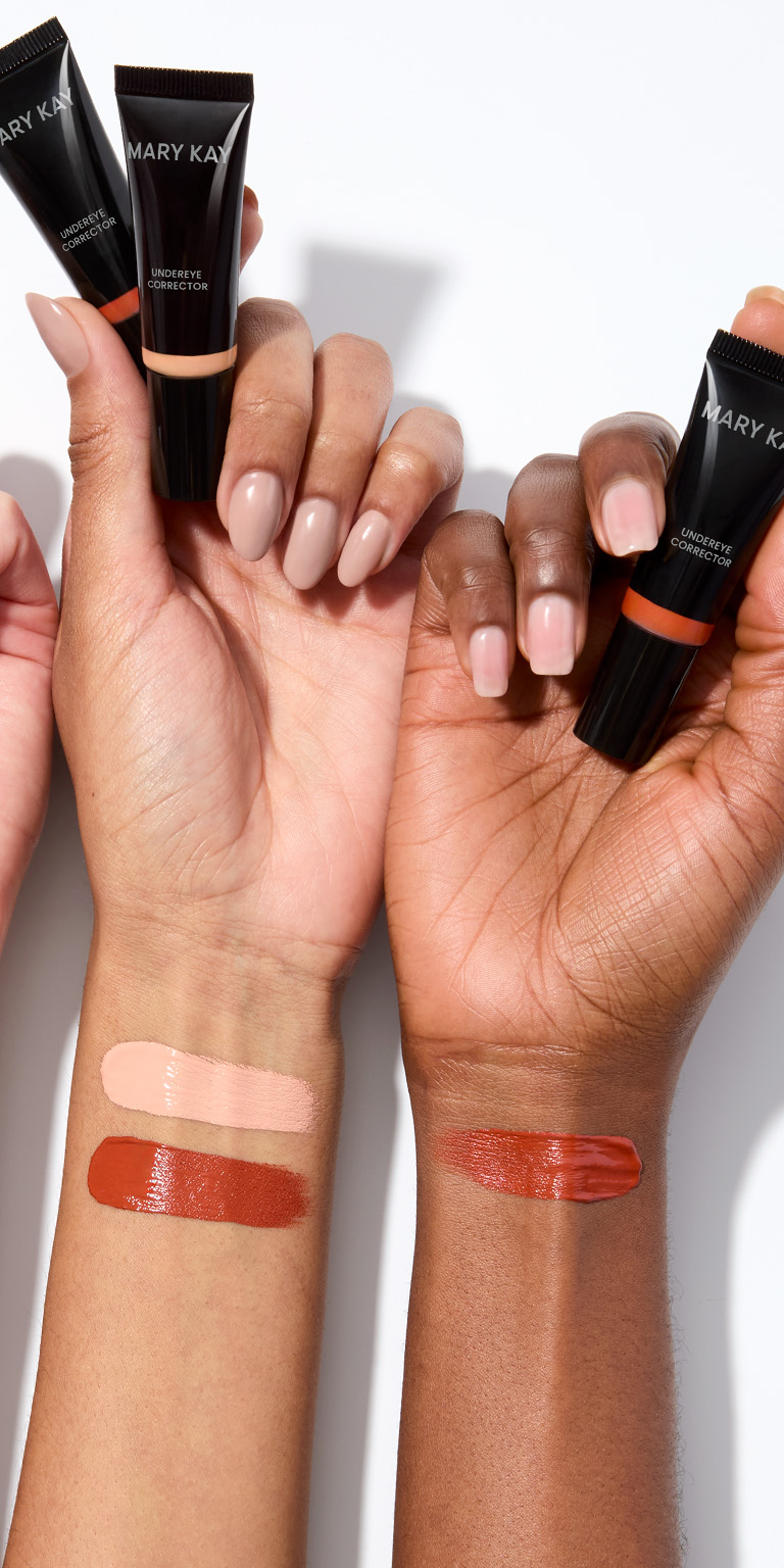 A close up of a woman's face with eye cream.